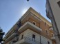 Risanamento dell’intonaco dei locali tecnici condominiali e Rifacimento del parapetto di due balconi di una unità abitativa. - Riparazione parapetto del balcone d'angolo.