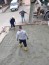 Risanamento degli intonaci del garage, dei frontalini e dei sottobalconi in c.a., sostituzione del lucernario, ripristino della guaina del tetto e sistemazione del posto auto esterno realizzazione di schermatura del portone di ingresso. - Realizzazione massetto armato per posto auto in blocchetti di cls autobloccanti.